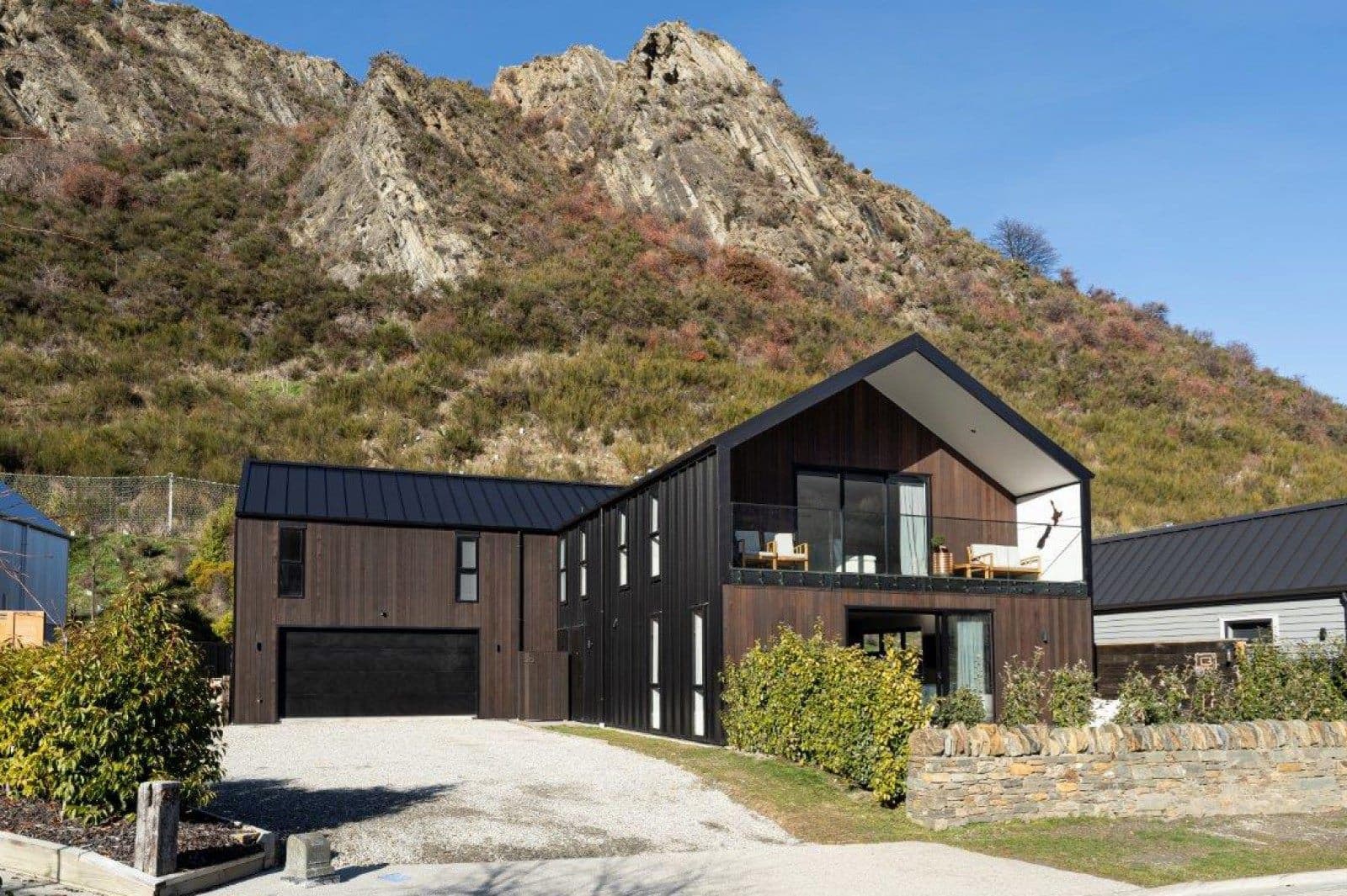 Completed timber home on a hillside section
