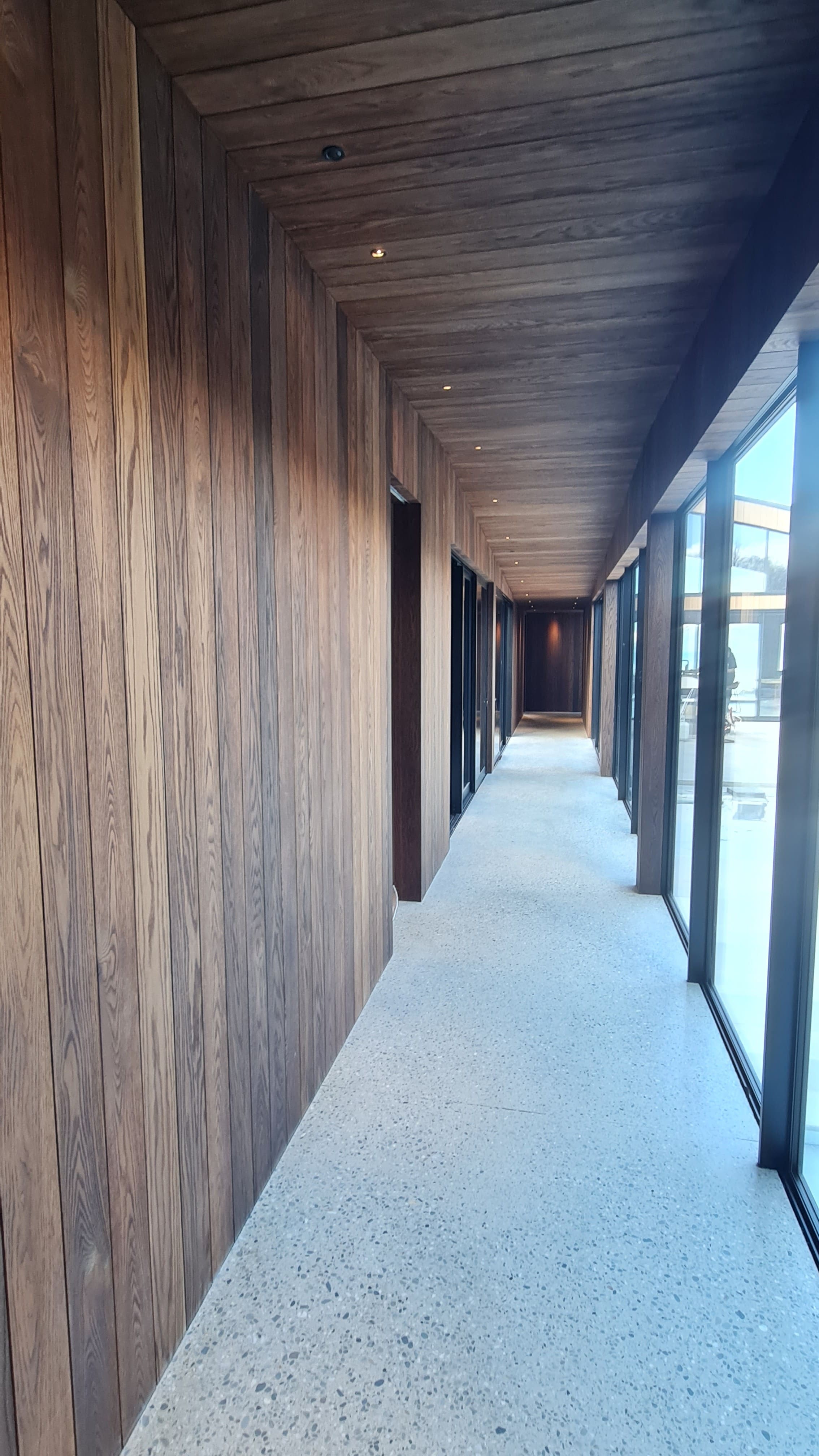 Corridor lined floor to ceiling in oak